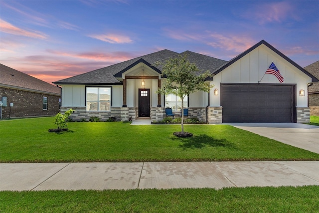 222 Overlook Trl, Copperas Cove, TX 76522 - view of front of property featuring stone siding, a garage, concrete driveway, board and batten siding, and a yard