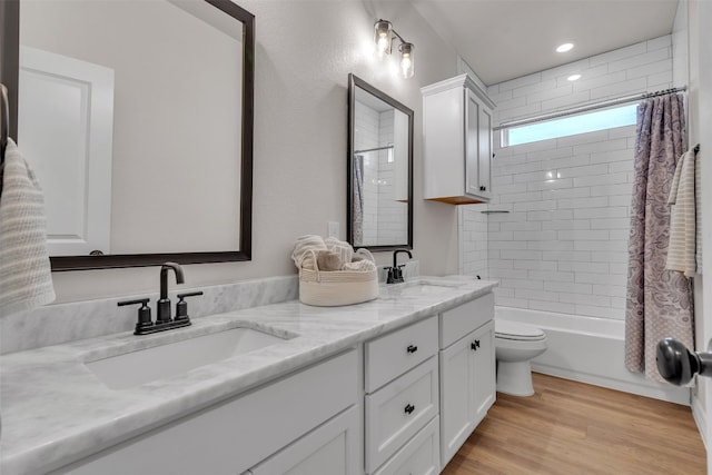222 Overlook Trl, Copperas Cove, TX 76522 - bathroom featuring toilet, double vanity, shower / bath combination with curtain, and wood finished floors