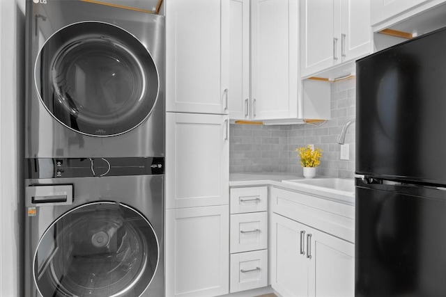 1707 Collier St, Austin, TX 78704 - washroom with stacked washer and clothes dryer
