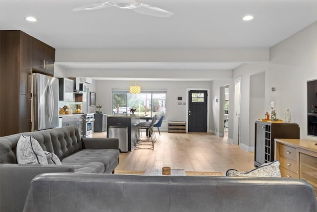 1707 Collier St, Austin, TX 78704 - living area featuring light wood-style flooring, recessed lighting, a ceiling fan, and baseboards