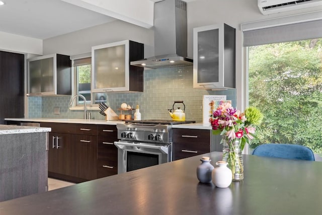 1707 Collier St, Austin, TX 78704 - kitchen with wall chimney exhaust hood, high end stainless steel range, tasteful backsplash, and modern cabinets
