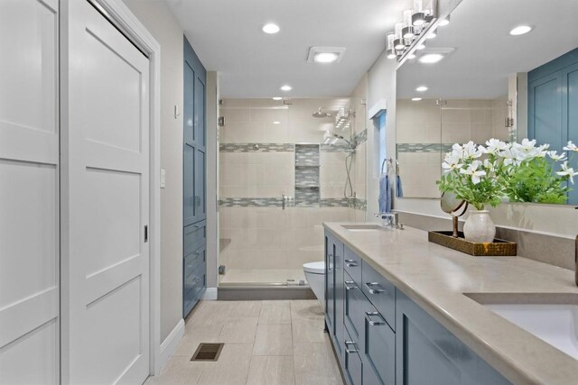 1707 Collier St, Austin, TX 78704 - full bathroom with double vanity, a stall shower, and recessed lighting