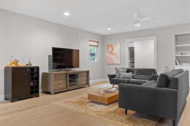 1707 Collier St, Austin, TX 78704 - living area featuring stacked washer / dryer, light wood-type flooring, ceiling fan, baseboards, and recessed lighting