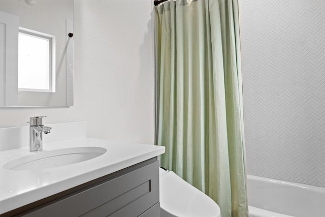 1707 Collier St, Austin, TX 78704 - bathroom featuring vanity, shower / bath combo with shower curtain, and toilet