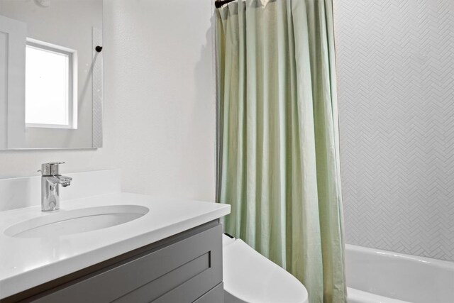 1707 Collier St, Austin, TX 78704 - bathroom featuring vanity and shower / tub combo with curtain