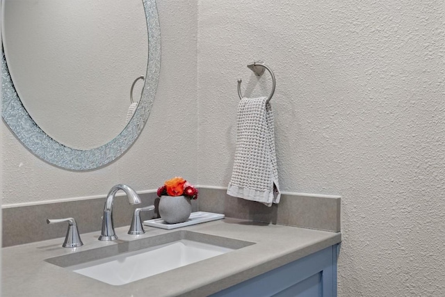 1707 Collier St, Austin, TX 78704 - bathroom with vanity and a textured wall