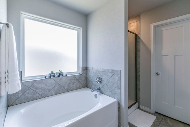 7002 Spirit Of The W Dr, Killeen, TX 76549 - bathroom featuring a garden tub, a stall shower, and tile patterned flooring