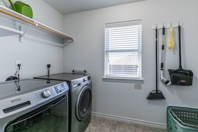 7002 Spirit Of The W Dr, Killeen, TX 76549 - laundry room with washing machine and clothes dryer and light tile patterned floors