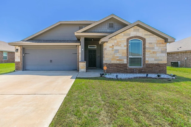 7002 Spirit Of The W Dr, Killeen, TX 76549 - view of front of property with a front lawn, a garage, driveway, and brick siding
