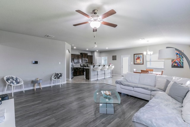 7002 Spirit Of The W Dr, Killeen, TX 76549 - living area featuring a chandelier, a ceiling fan, dark wood finished floors, and recessed lighting