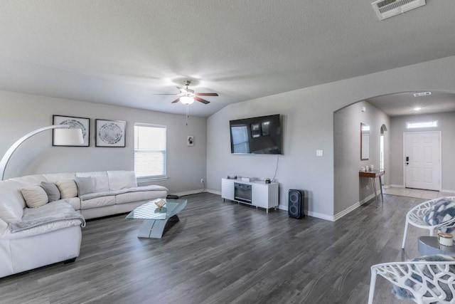 7002 Spirit Of The W Dr, Killeen, TX 76549 - living area with arched walkways, wood finished floors, a ceiling fan, and a textured ceiling
