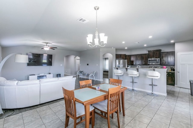 7002 Spirit Of The W Dr, Killeen, TX 76549 - dining space with arched walkways, light tile patterned floors, ceiling fan, a chandelier, and recessed lighting