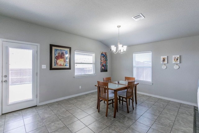 7002 Spirit Of The W Dr, Killeen, TX 76549 - dining area with a chandelier, healthy amount of natural light, light tile patterned floors, and vaulted ceiling