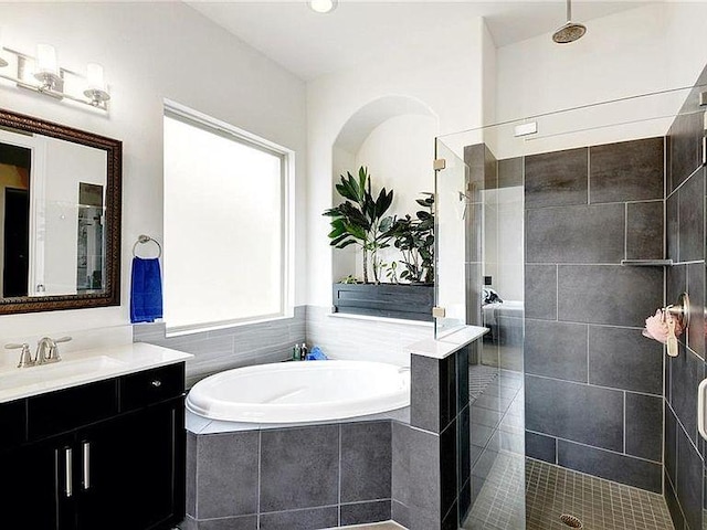 21305 Resource Rd, Pflugerville, TX 78660 - bathroom with vanity, a bath, and tiled shower