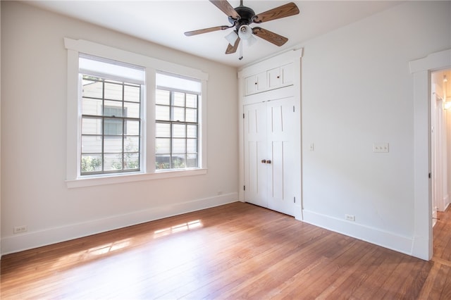 1206 W 22nd 1/2 St, Austin, TX 78705 - unfurnished bedroom featuring multiple windows, light wood finished floors, baseboards, and a closet
