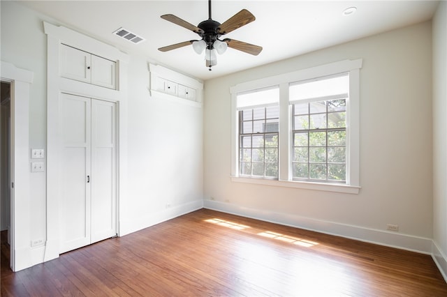 1206 W 22nd 1/2 St, Austin, TX 78705 - unfurnished bedroom with wood finished floors, baseboards, and a closet