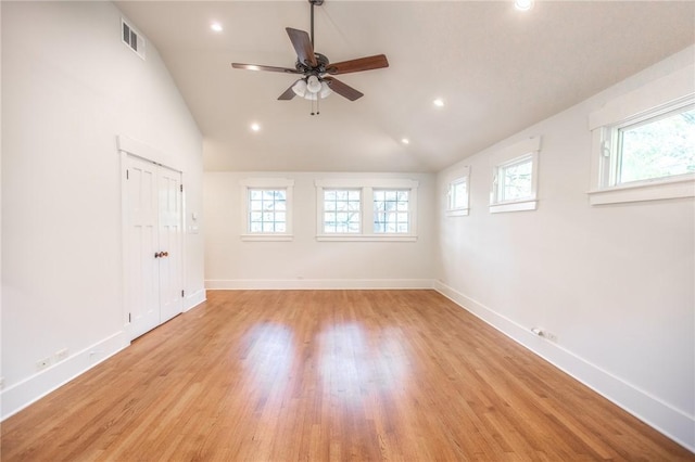 1206 W 22nd 1/2 St, Austin, TX 78705 - unfurnished room featuring plenty of natural light, lofted ceiling, baseboards, light wood finished floors, and recessed lighting