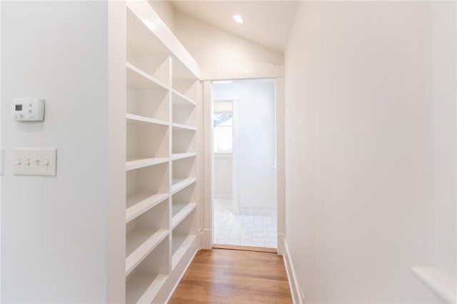 1206 W 22nd 1/2 St, Austin, TX 78705 - corridor with light wood finished floors, lofted ceiling, and recessed lighting