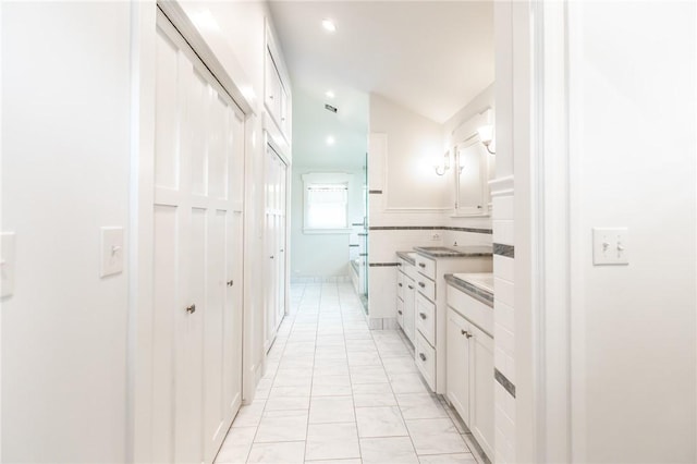 1206 W 22nd 1/2 St, Austin, TX 78705 - full bath with vanity, marble look tile flooring, and recessed lighting