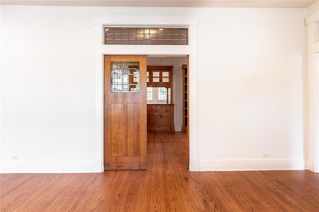 1206 W 22nd 1/2 St, Austin, TX 78705 - unfurnished room with baseboards and wood finished floors
