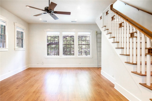 1206 W 22nd 1/2 St, Austin, TX 78705 - unfurnished living room featuring light wood finished floors, baseboards, stairway, a ceiling fan, and recessed lighting