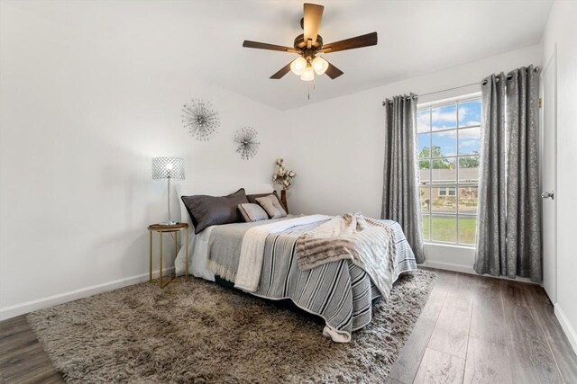 11533 Sandy Loam Trl, Austin, TX 78750 - bedroom featuring baseboards, wood finished floors, and a ceiling fan