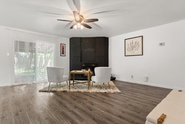 11533 Sandy Loam Trl, Austin, TX 78750 - living area with wood finished floors, ceiling fan, a fireplace, and baseboards