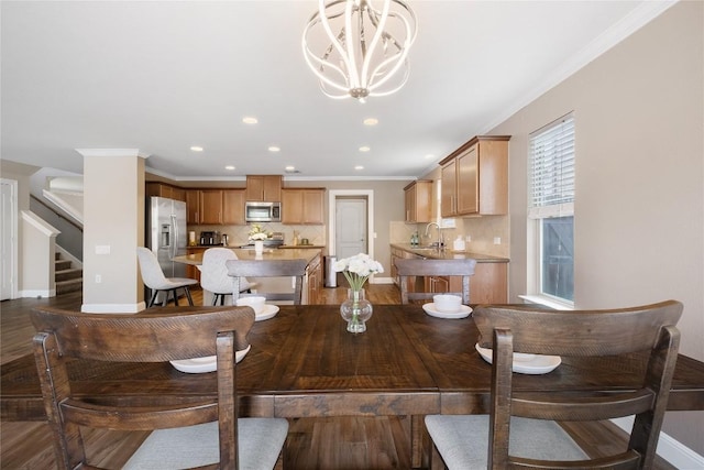 9008 Winter Haven Rd, Austin, TX 78747 - dining area featuring a chandelier, recessed lighting, baseboards, stairway, and ornamental molding