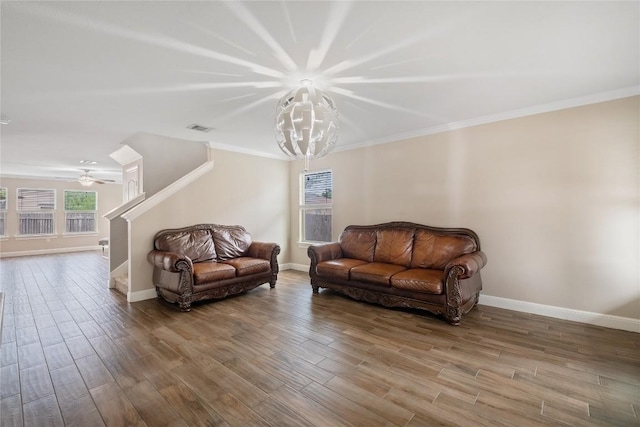 9008 Winter Haven Rd, Austin, TX 78747 - living room featuring baseboards, wood finished floors, crown molding, stairway, and a ceiling fan