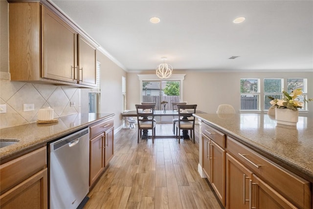 9008 Winter Haven Rd, Austin, TX 78747 - kitchen featuring dishwasher, tasteful backsplash, a chandelier, light wood-type flooring, and light stone countertops
