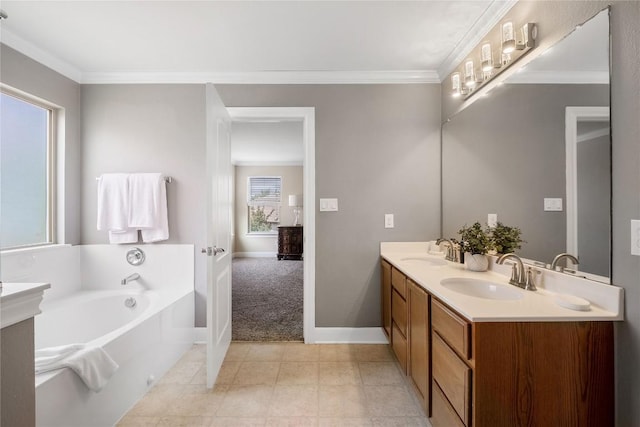 9008 Winter Haven Rd, Austin, TX 78747 - bathroom with double vanity, a garden tub, crown molding, and baseboards