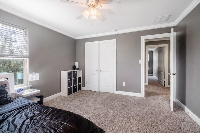 9008 Winter Haven Rd, Austin, TX 78747 - bedroom featuring ornamental molding, carpet, a closet, baseboards, and a ceiling fan