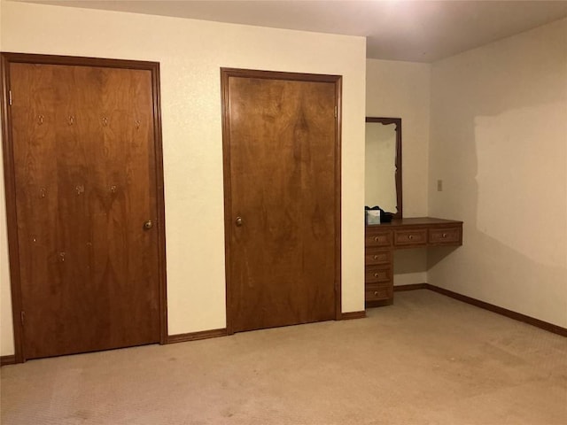 319 Fawnridge St, Georgetown, TX 78628 - unfurnished bedroom with light carpet, multiple closets, and an office area