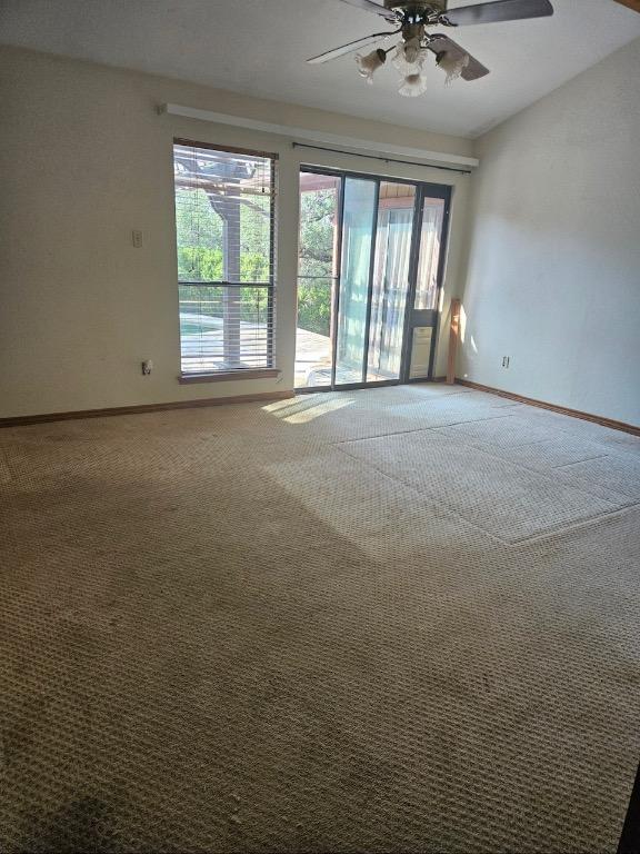 319 Fawnridge St, Georgetown, TX 78628 - unfurnished room featuring carpet flooring, ceiling fan, and lofted ceiling