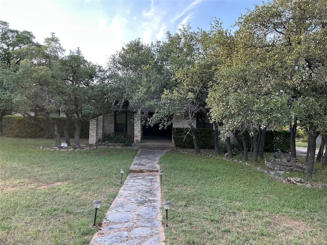 319 Fawnridge St, Georgetown, TX 78628 - view of property hidden behind natural elements with a front lawn