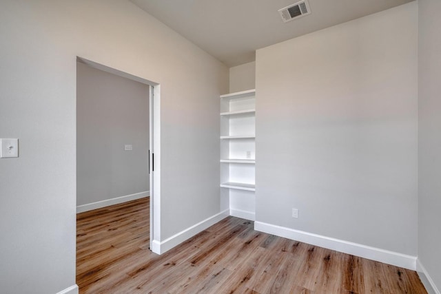 203 Alonzo Dr, Del Valle, TX 78617 - spare room featuring light wood-type flooring