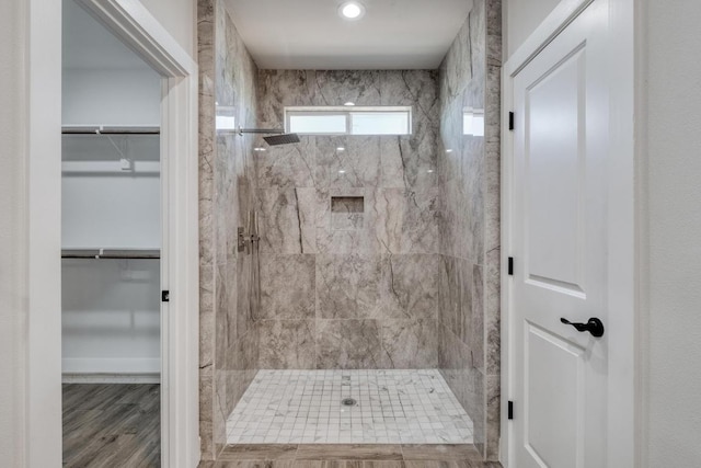 203 Alonzo Dr, Del Valle, TX 78617 - bathroom featuring a marble finish shower and a spacious closet