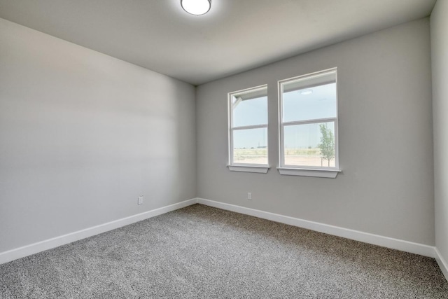 203 Alonzo Dr, Del Valle, TX 78617 - unfurnished room with baseboards and carpet floors