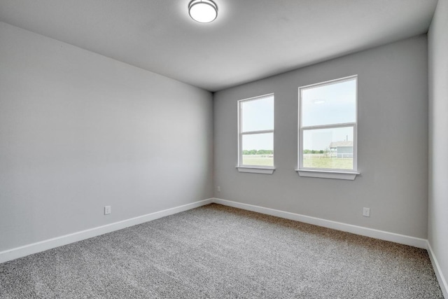 203 Alonzo Dr, Del Valle, TX 78617 - carpeted empty room featuring baseboards