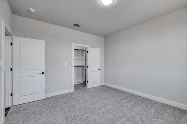 203 Alonzo Dr, Del Valle, TX 78617 - unfurnished bedroom with carpet and baseboards