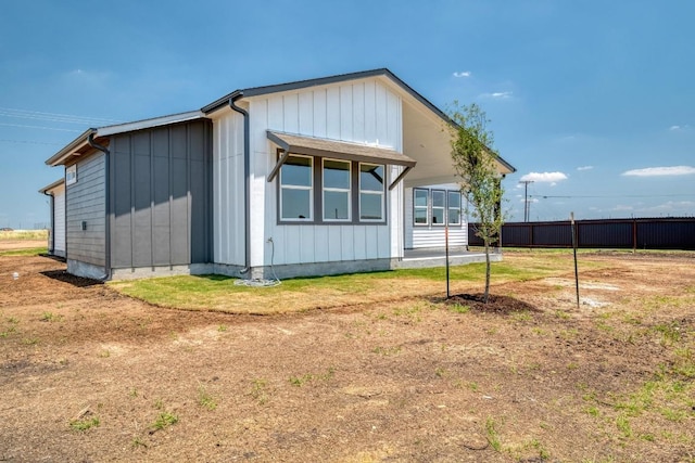 203 Alonzo Dr, Del Valle, TX 78617 - view of home's exterior featuring board and batten siding