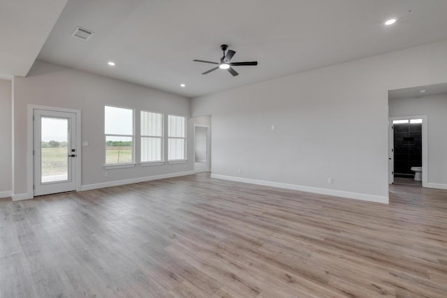 203 Alonzo Dr, Del Valle, TX 78617 - unfurnished living room featuring ceiling fan, recessed lighting, and light wood-type flooring