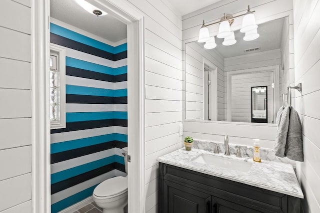 810 River Rd, Wimberley, TX 78676 - bathroom with vanity and toilet
