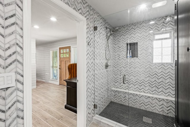 810 River Rd, Wimberley, TX 78676 - bathroom featuring a stall shower, vanity, and wood tiled floors