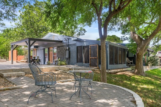 810 River Rd, Wimberley, TX 78676 - view of patio with a sunroom