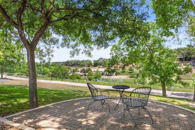 810 River Rd, Wimberley, TX 78676 - view of patio / terrace with a water view
