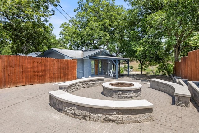 810 River Rd, Wimberley, TX 78676 - view of patio / terrace featuring an outdoor fire pit