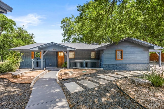 810 River Rd, Wimberley, TX 78676 - view of front of property featuring a porch and brick siding
