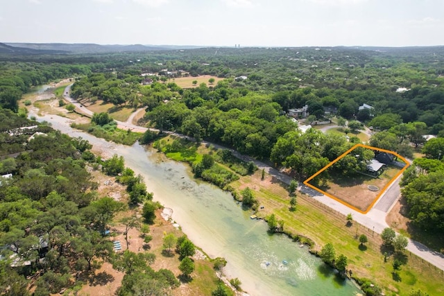 810 River Rd, Wimberley, TX 78676 - aerial view of property and surrounding area featuring property parcel outlined and a forest