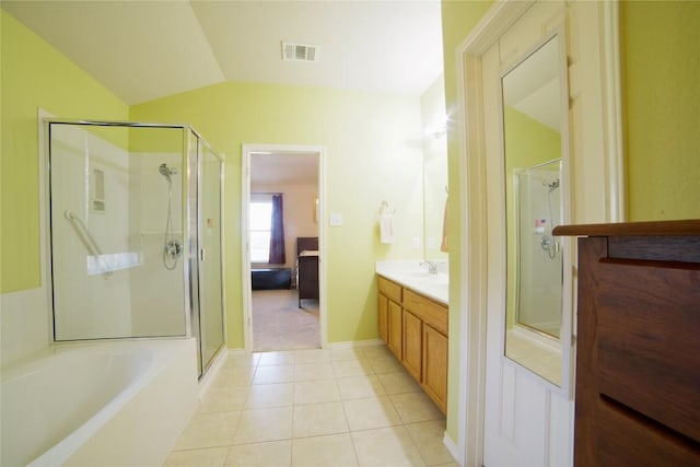 1800 Quiet Meadows Cv, Pflugerville, TX 78660 - bathroom featuring a shower stall, tile patterned flooring, vanity, vaulted ceiling, and a garden tub